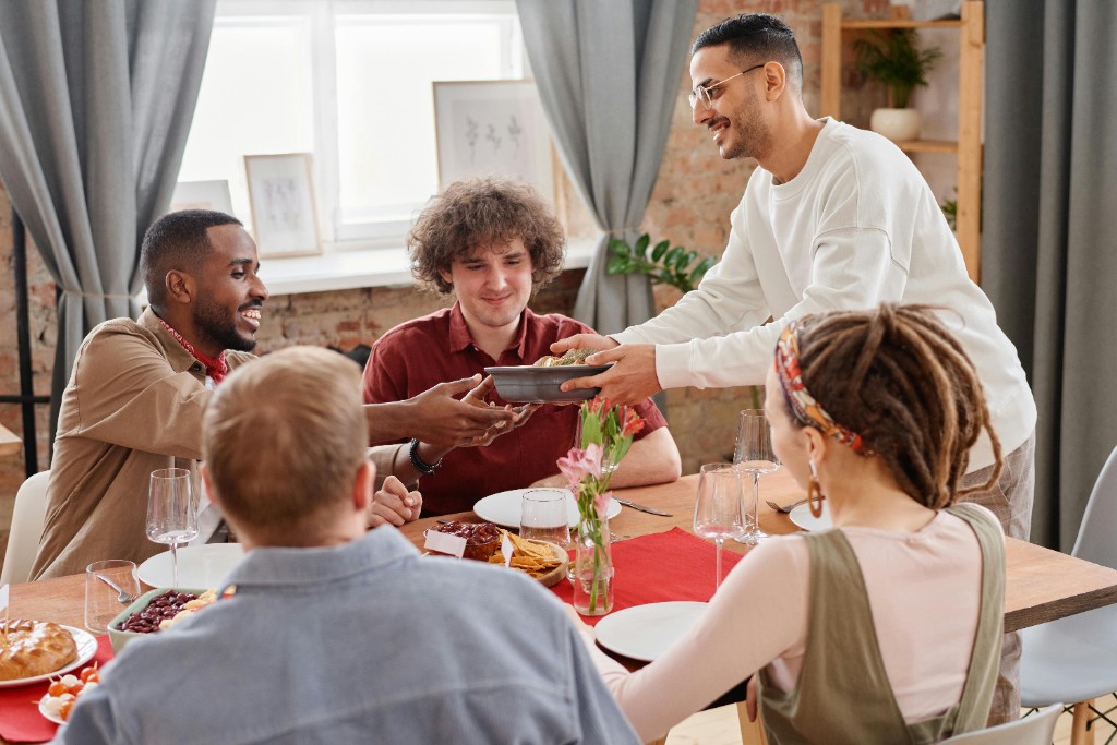 Diverse group of people sharing a meal together